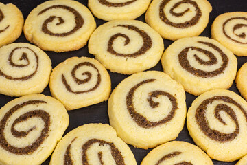background of swirl cookies with pecan nuts