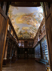 Two story library with heaven painted on the ceiling