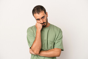 Young caucasian man isolated on white background who feels sad and pensive, looking at copy space.