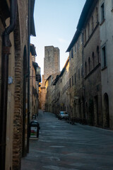 Fototapeta na wymiar Streets and buildings of little ancient town of San Gimignano, Tuscany, along via Francigena