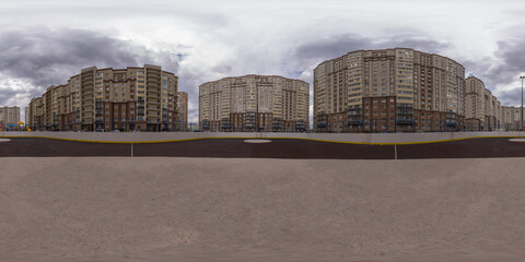 Spherical 360 degree panorama of public courtyard hockey rink in residential area of city. Full...