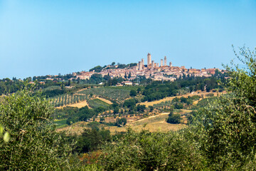 Fototapeta na wymiar Colorful skyline of little ancient town of San Gimignano, Tuscany, along via Francigena