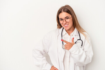Fototapeta premium Young doctor Russian woman isolated on white background smiling and pointing aside, showing something at blank space.