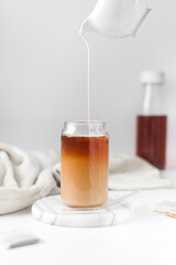 Cold brew tea with milk being poured, ombre cold brew tea