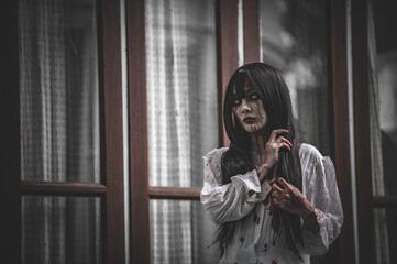 Portrait of asian woman make up ghost,Scary horror scene for background,Halloween festival...
