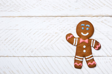 Xmas gingerbread man on wooden boards. Christmas festive background