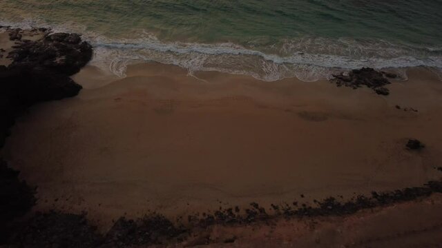 Coast of West Coast Photo Point in the town of El Cotillo in the north of the island of Fuerteventura flown over with a drone, Canary Islands. Spain, 4k video