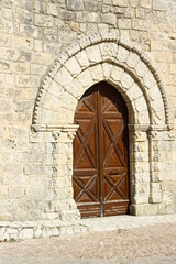 Fototapeta na wymiar San Salvatore church wooden gate, Caltabellotta, Agrigento, Sicily, Italy
