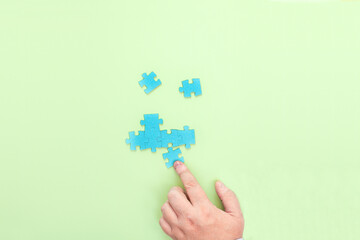 Businessman connecting pieces of a puzzle