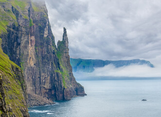Breathtaking view of Trøllkonufingur (Troll woman or witch finger), a 313 m tall monolith on...