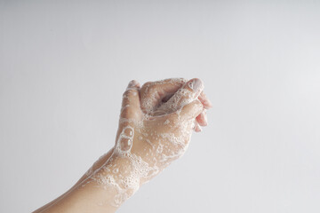 Beautiful woman hands washing with soap to prevent germs, bacteria, or viruses. Cleaning hands. Hygiene concept                