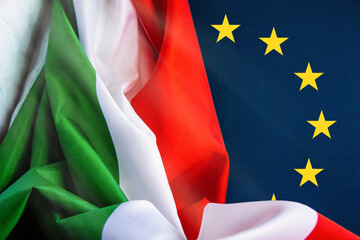 Fototapeta premium Italy flag covered up on European Union EU flag and space for text. partnerships, conflict and independence 