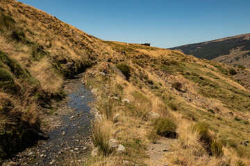 One of the ancient water channel (Acequias) of the Poqueira valley, Las Alpujarras, Sierra Nevada National Park, Andalusia, Spain