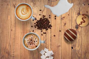 Background of coffee, cappuccino, sugar, milk, cookies on the table.