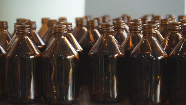 Small medicine bottles medicine container.  A close-up view of small amber bottles with white caps