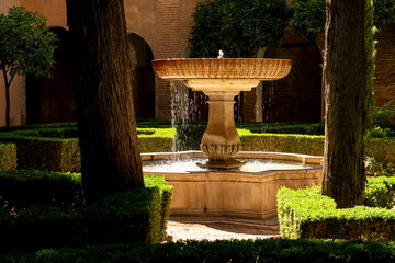 The big central marble fountain in the picturesque Daraxa's Garden (Jardines de Daraxa), part of the Nasrid palaces, Alhambra de Granada UNESCO World Heritage Site, Granada, Andalusia, Spain