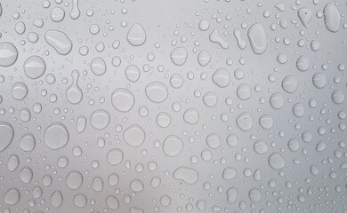 water droplets on gray metal surface