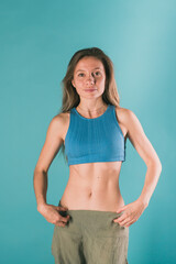 Fototapeta na wymiar Portrait of young slim fitness woman. Sport and healthy lifestyle concept.