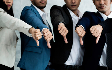 Group of five people business team show dislike or unlike thump down and unsuccessful job. Hands...