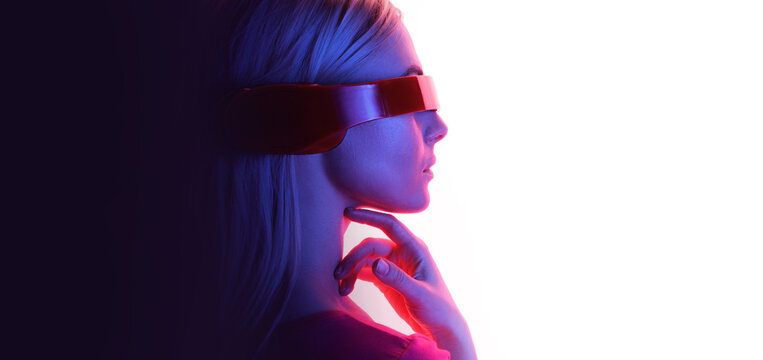 Double exposure of woman and futuristic holographic interface to display data. Female in futuristic costume using VR helmet. Augmented reality, future technology, game concept. White background.
