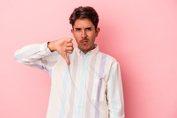 Young mixed race man isolated on white background showing thumb down, disappointment concept.