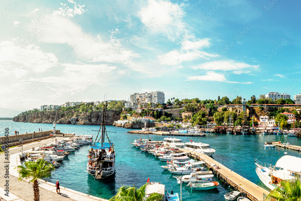 Wall mural pleasure yachts and boats in the port of Kaleici, the historical center of Antalya, Turkey. tourism and travel, a historical place for boat trips