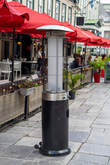 Fototapeta na wymiar Warming gas heaters in a street cafe