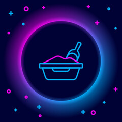 Glowing neon line Cat litter tray with shovel icon isolated on black background. Sandbox cat with shovel. Colorful outline concept. Vector