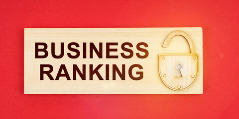 On a red background there is a small plaque on it with a lock and an inscription - BUSINESS RANKING
