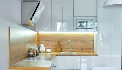 Fototapeta na wymiar Modern kitchen interior with wooden and white elements, domestic life, home showcase interior concept