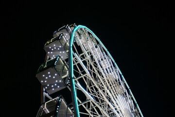 The Kyiv/Kiev Great wheel (ferris wheel) located in Kontraktova Squere at night