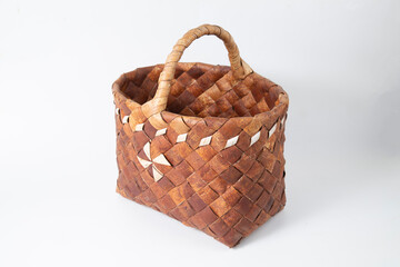 Birch bark basket on a white background.Handmade basket.
