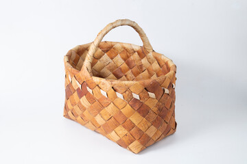 Fototapeta na wymiar Birch bark basket on a white background.Handmade basket.