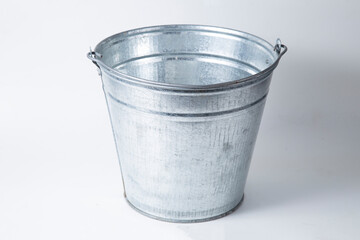 The bucket is galvanized on a white background.Household goods.