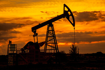 Oil and gas industry. Oil pump oil rig energy industrial machine for petroleum in the sunset background, Increase in oil production