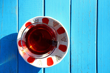 glass of Turkish tea on wooden table