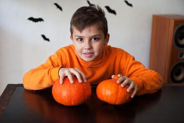 the boy with pumpkins