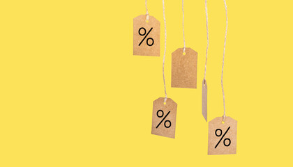 Isolated price tags on a yellow background with copy space