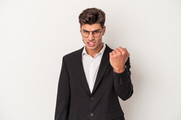 Young business caucasian man isolated on white background showing fist to camera, aggressive facial expression.