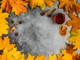 Autumn yellow leaves, cinnamon, star anise and oranges. Background picture.