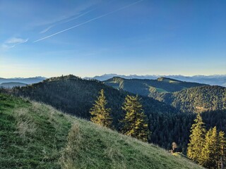 Summit cross on the schnebelhorn in the zurich oberland. Autumn sunrise. Great hiking area in Switzerland. Hill, sun