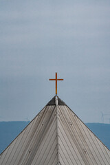 golden cross on church