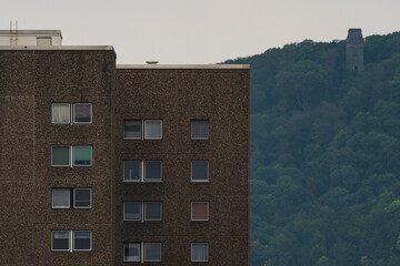 high rise development with a forest in the background 