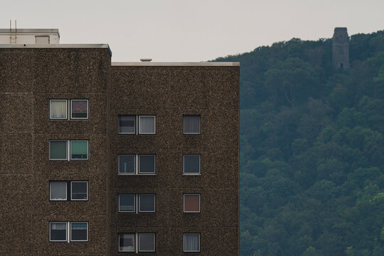 high rise development with a forest in the background 