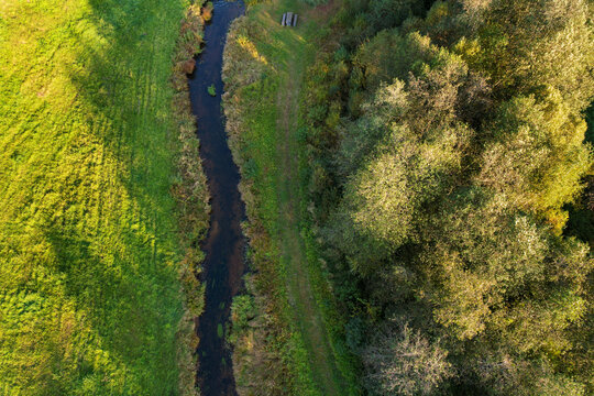 Beautiful colors of autumn. Forest, meadow and river photographed with a drone on sunny day. Regional park of neris in Lithuania. Dukstai educational trail. Real is beautiful  