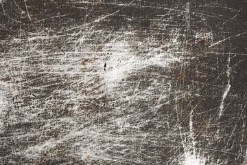 The texture of old metal covered with scratches