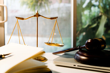 Business and lawyers discussing contract papers with brass scale on desk in office. Law, legal...