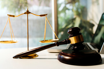 Business and lawyers discussing contract papers with brass scale on desk in office. Law, legal...