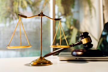 Business and lawyers discussing contract papers with brass scale on desk in office. Law, legal...