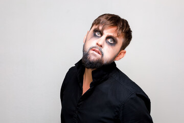 halloween makeup bearded man posing on camera